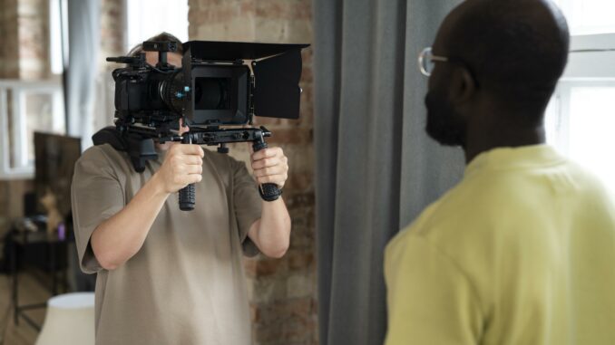 man-filming-with-professional-camera